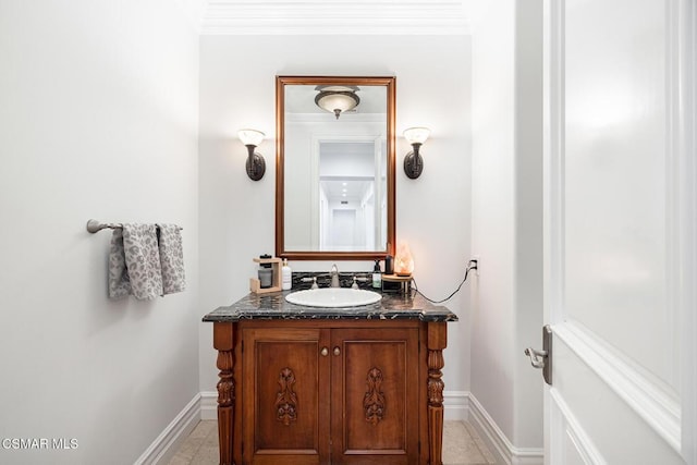 bathroom with vanity and crown molding