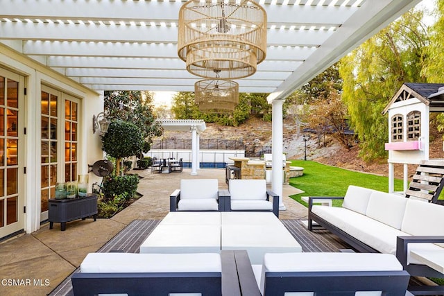 view of patio / terrace featuring an outdoor living space, a pergola, and french doors