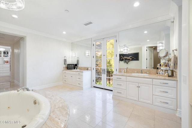 bathroom with ornamental molding, a bathing tub, vanity, and french doors