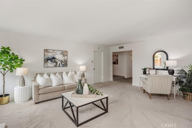 living room featuring light colored carpet