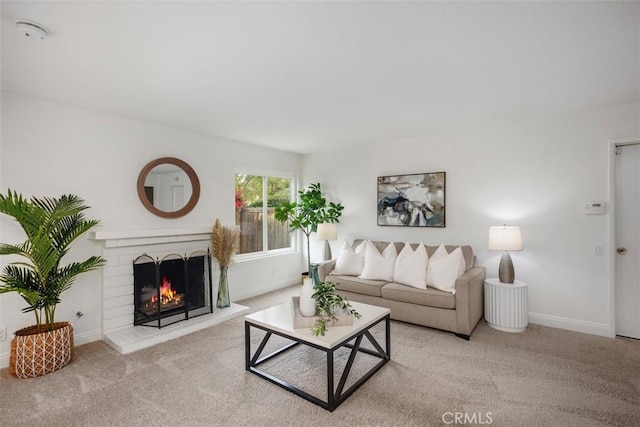 carpeted living room featuring a brick fireplace