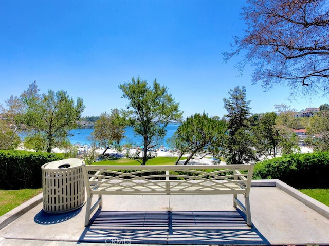 view of patio with a water view