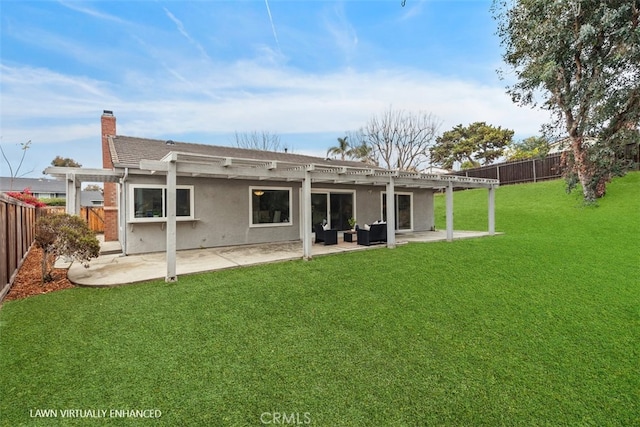 rear view of property with a yard, a patio area, and a pergola