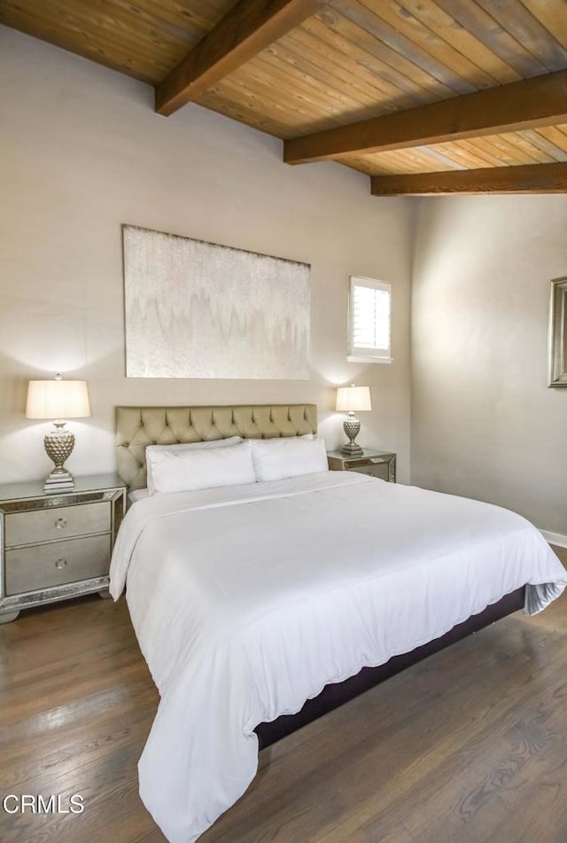 bedroom featuring dark wood-type flooring, wooden ceiling, and beamed ceiling