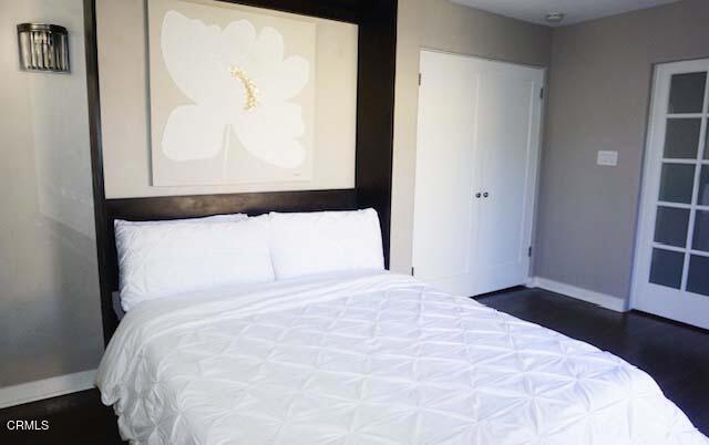 bedroom featuring dark hardwood / wood-style floors