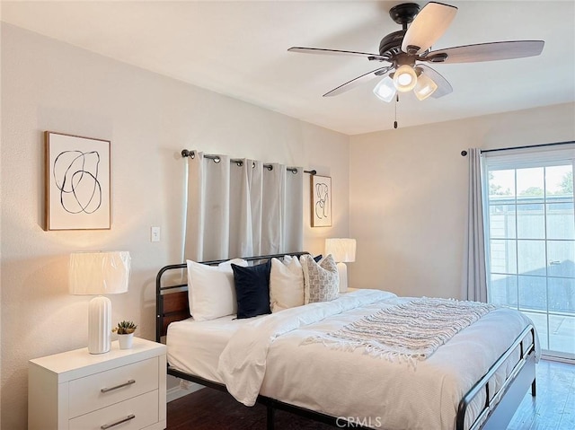 bedroom featuring wood-type flooring and ceiling fan