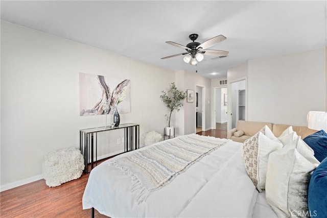 bedroom featuring dark hardwood / wood-style floors and ceiling fan