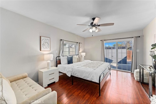 bedroom with access to exterior, dark hardwood / wood-style floors, and ceiling fan