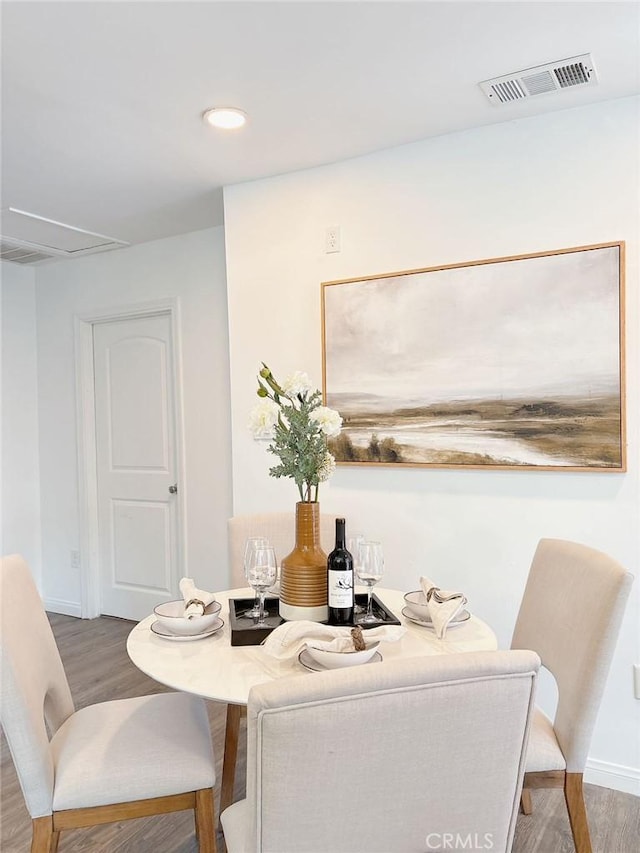 dining room with dark wood-type flooring