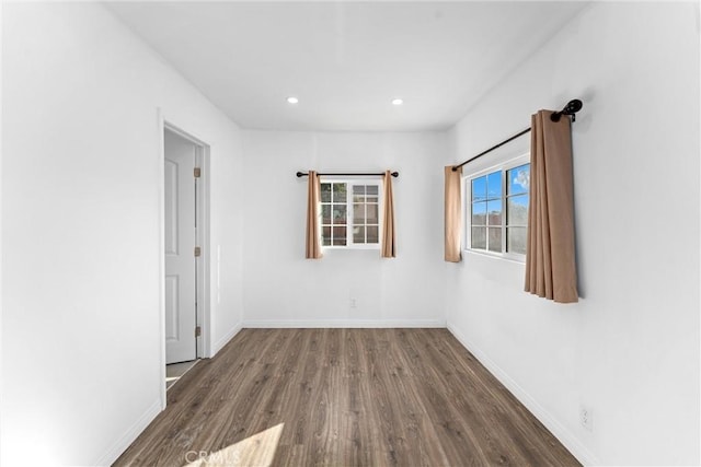 unfurnished room featuring dark wood-type flooring