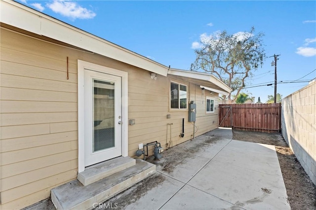 entrance to property with a patio area