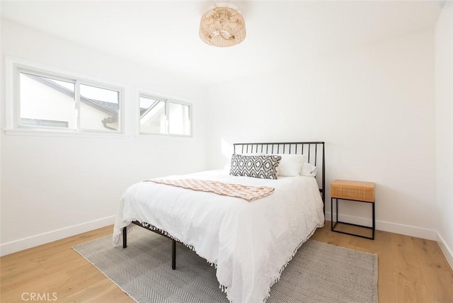 bedroom with hardwood / wood-style floors