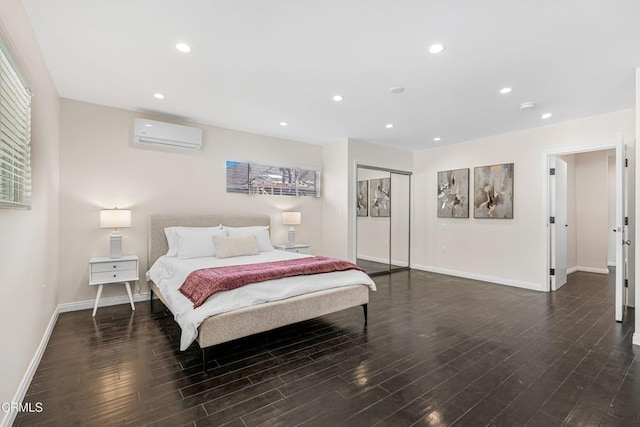bedroom featuring dark wood-style floors, a closet, baseboards, recessed lighting, and a wall mounted AC