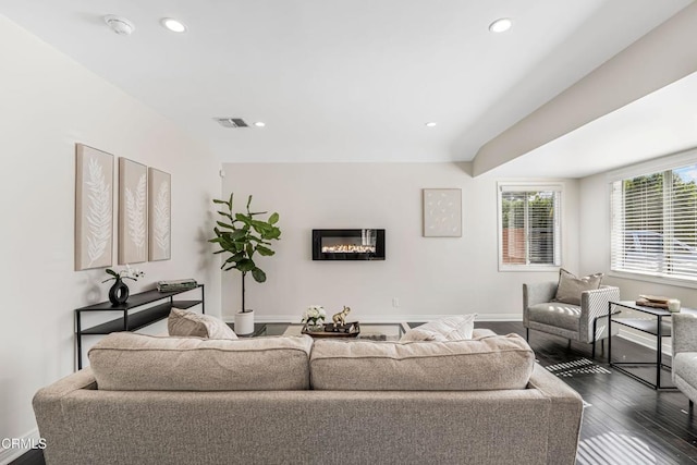 living room featuring recessed lighting, dark wood-style flooring, baseboards, and visible vents