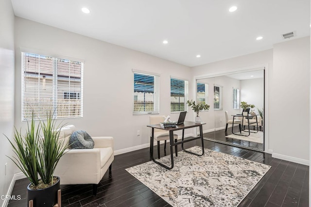 office featuring dark wood-style flooring, visible vents, recessed lighting, and baseboards