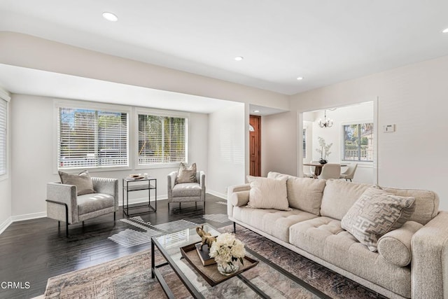 living room with dark wood-style floors, baseboards, a chandelier, and recessed lighting