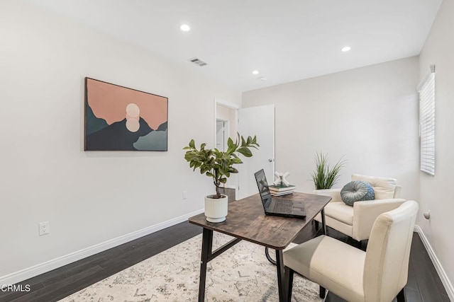office space with dark wood-style flooring, visible vents, recessed lighting, and baseboards