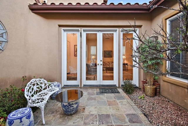24238 Owl Ct, Corona, CA 92883 - property entrance with a patio, french doors, and stucco siding