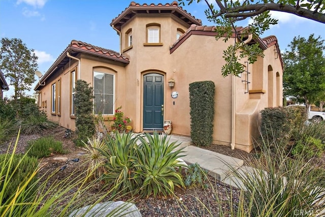 24238 Owl Ct, Corona, CA 92883 - mediterranean / spanish house with a tile roof and stucco siding