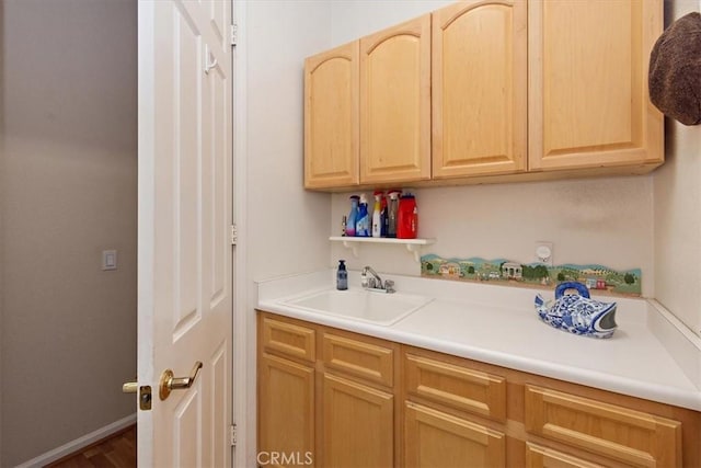 24238 Owl Ct, Corona, CA 92883 - kitchen featuring light countertops, baseboards, a sink, open shelves, and light brown cabinetry