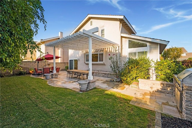 back of property with a fire pit, a yard, a pergola, a patio area, and area for grilling