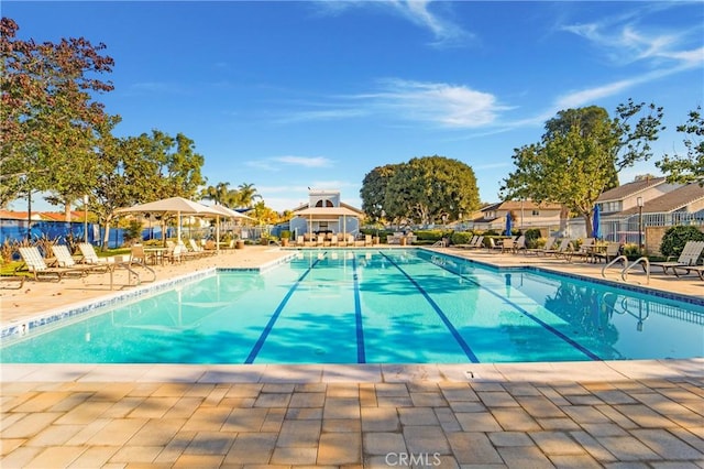 view of swimming pool featuring a gazebo and a patio area