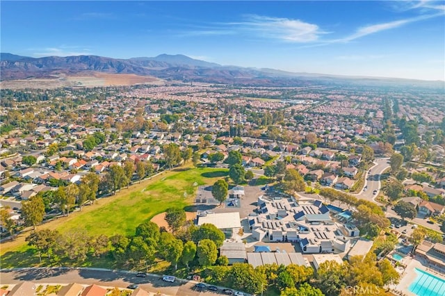 birds eye view of property with a mountain view