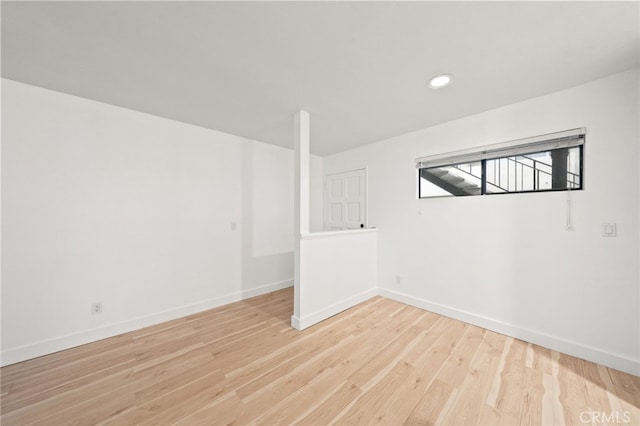 spare room featuring light hardwood / wood-style flooring