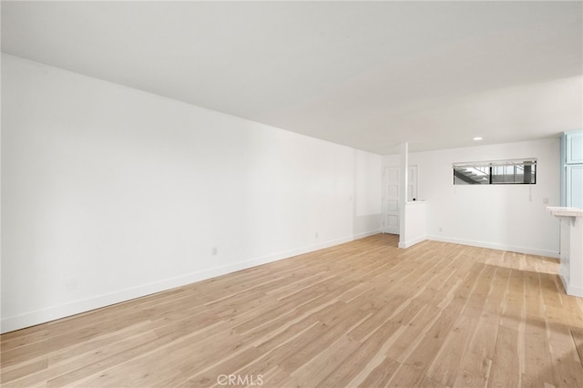 unfurnished living room featuring light hardwood / wood-style flooring