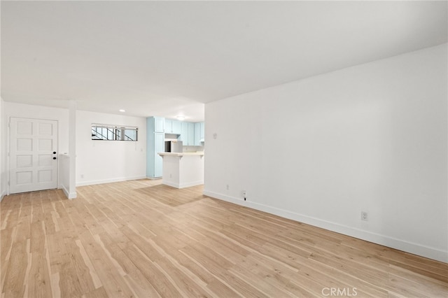 unfurnished living room with light hardwood / wood-style floors