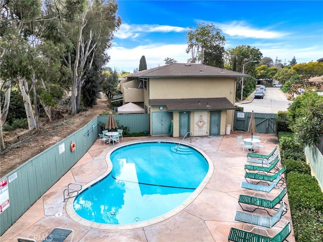 view of swimming pool with a patio area