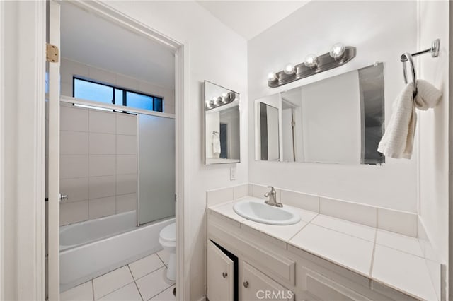 full bathroom with vanity, toilet, tile patterned flooring, and combined bath / shower with glass door