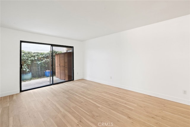 spare room featuring light hardwood / wood-style flooring