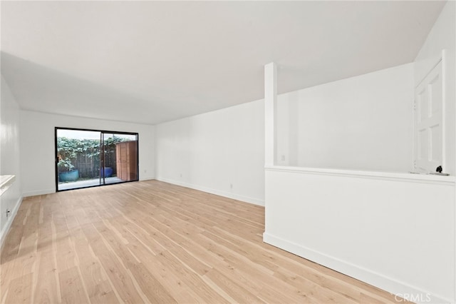 spare room with light wood-type flooring