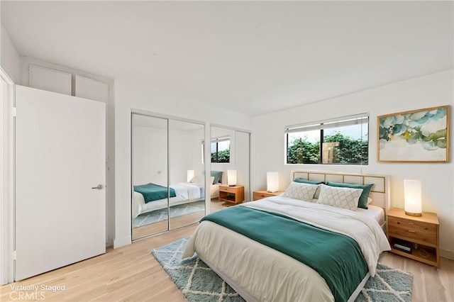 bedroom with light hardwood / wood-style flooring