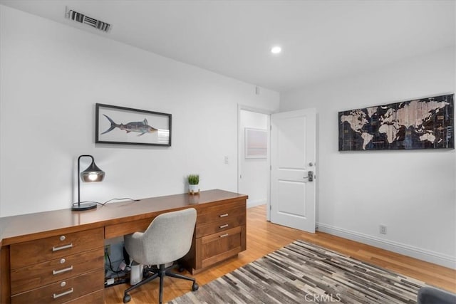 office area with light hardwood / wood-style flooring