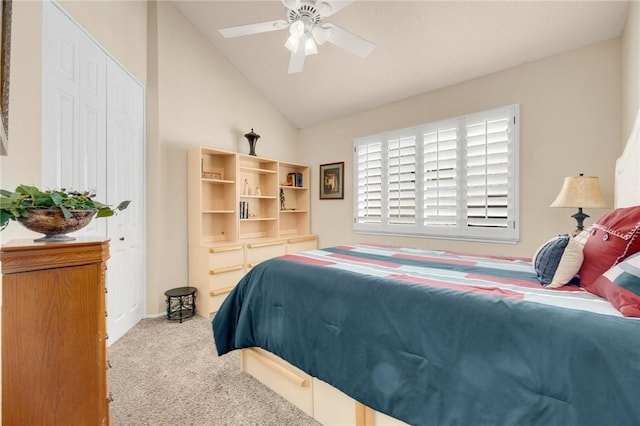 bedroom with lofted ceiling, light carpet, and ceiling fan