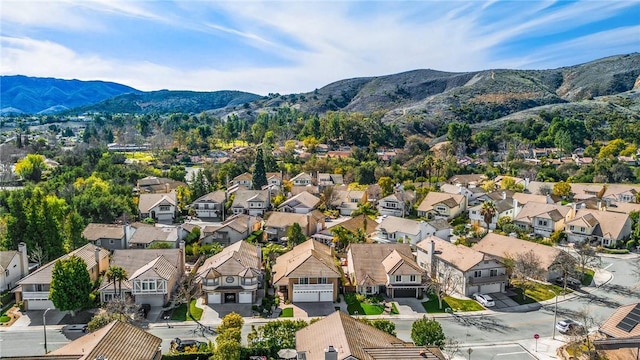 birds eye view of property featuring a mountain view