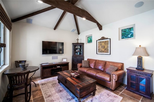 living area featuring lofted ceiling with beams and visible vents
