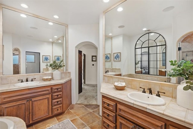 31872 Paseo Cielo, San Juan Capistrano, CA 92675 - full bath featuring tasteful backsplash, recessed lighting, two vanities, and tile patterned flooring
