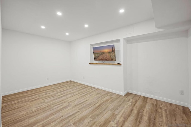 spare room with light wood-type flooring