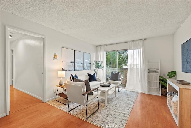 3565 Linden Ave Unit 220, Long Beach, CA 90807 - living room with light wood-style floors and a textured ceiling