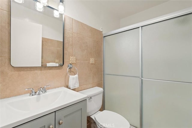 3565 Linden Ave Unit 220, Long Beach, CA 90807 - bathroom featuring vanity, tile walls, and an enclosed shower