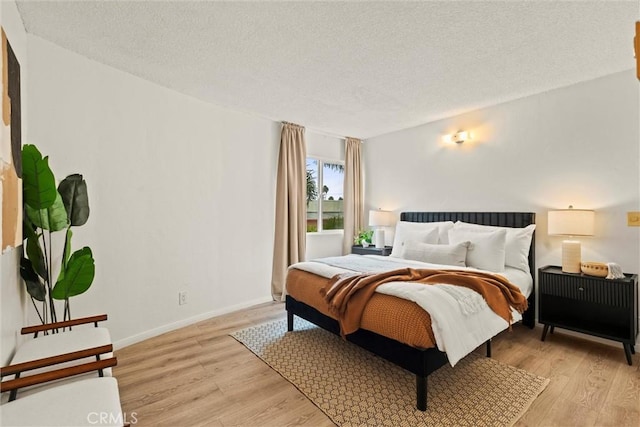 3565 Linden Ave Unit 220, Long Beach, CA 90807 - bedroom with light wood-type flooring and a textured ceiling