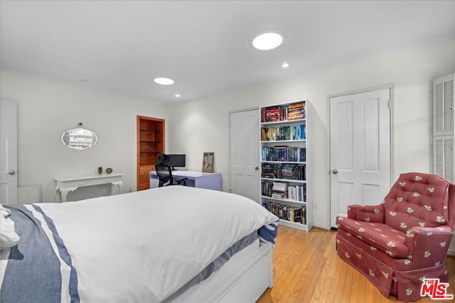 bedroom with light hardwood / wood-style flooring