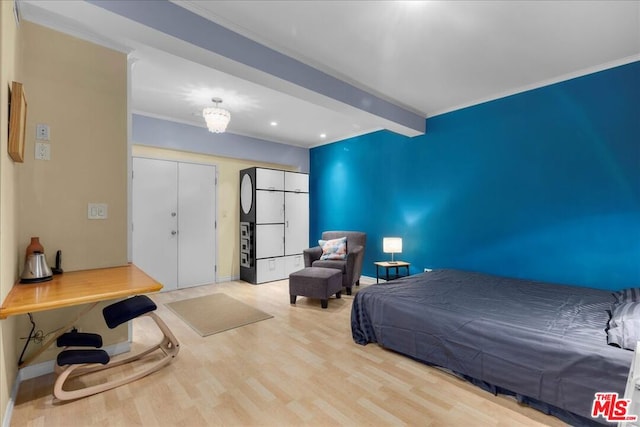 bedroom with hardwood / wood-style floors, crown molding, and beamed ceiling