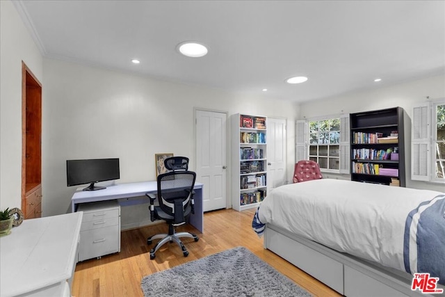 bedroom with light hardwood / wood-style floors