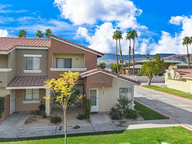 view of front of home with a mountain view