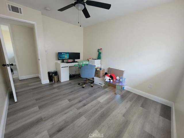 office space with ceiling fan and light wood-type flooring