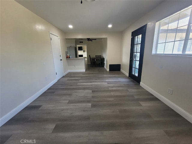 corridor with hardwood / wood-style floors